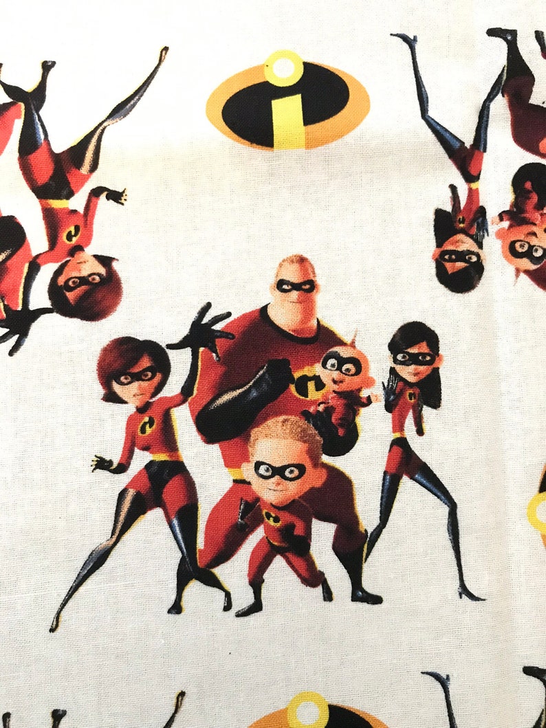 May include: A white fabric with a repeating pattern of the Incredibles family. The family is in their superhero costumes, with Mr. Incredible, Elastigirl, Violet, Dash, and Jack-Jack. The pattern also includes the iconic "I" symbol from the movie.
