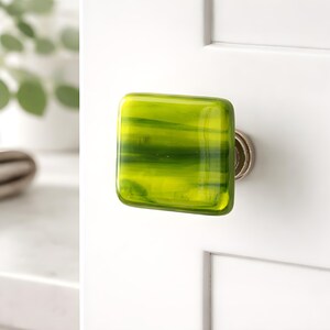 Fused glass knob in green wisps. Shades of green and yellow art glass cabinet knobs for kitchen or bath. Unique glass knobs and pulls