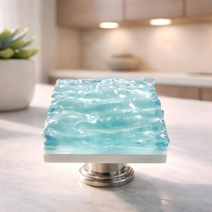 Glass Wave Knob in Light Blue. Opaque textured art glass cabinet knob in a one of a kind kitchen or bathroom knob by Uneek Glass Fusions.
