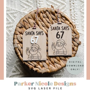 May include: Two wooden Christmas ornaments with the text "SANTA SAYS 67" and a Santa Claus illustration. The ornaments are hanging on a woven basket. The year "2025" is printed on the bottom of each ornament. The words "DIGITAL DOWNLOAD ONLY!" are also visible.