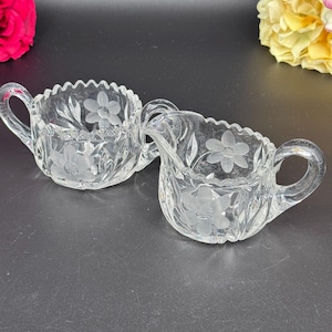 Antique Clear Glass Creamer & Sugar Bowl Set – Etched Daisy Pattern, Sawtooth Edge, Star Base