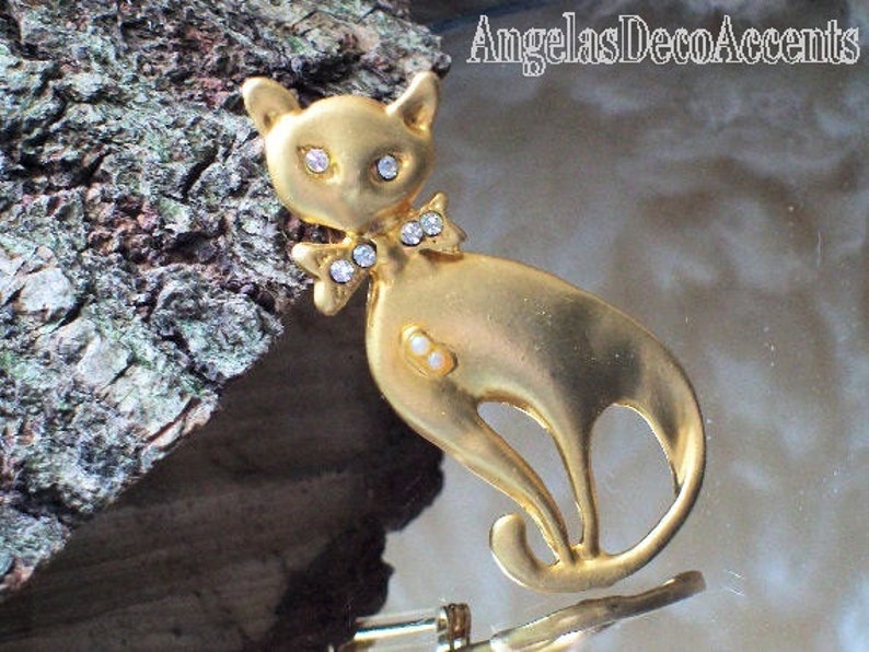 Vintage Cat Pin Pet Whimsy Sleek BroochFigural Mod JewelryVintage FelineCostume JewelryMatte Gold ToneCrystal Like Eyes and Bow Tie Pin image 1