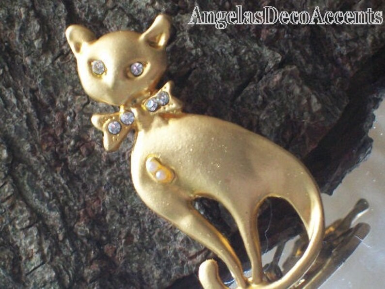 Vintage Cat Pin Pet Whimsy Sleek BroochFigural Mod JewelryVintage FelineCostume JewelryMatte Gold ToneCrystal Like Eyes and Bow Tie Pin image 2