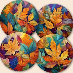 May include: Four circular coasters featuring a colourful autumn leaf design. The leaves are depicted in shades of orange, yellow, teal, and purple, creating a vibrant and artistic display. These coasters are ideal for adding a touch of seasonal flair to any home.