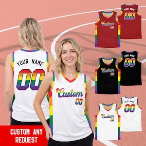 May include: A sleeveless basketball jersey featuring a rainbow-colored trim and side panels. The front displays the word Custom and the number 00 in rainbow colors. The back shows the text YOUR NAME and the number 00 in a rainbow gradient.