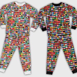 May include: Two sets of pajamas, each featuring a vibrant pattern of international flags. One set has a white crew neck and cuffs, while the other has a black crew neck and cuffs. The long-sleeved tops and pants are covered in a colorful array of flags.