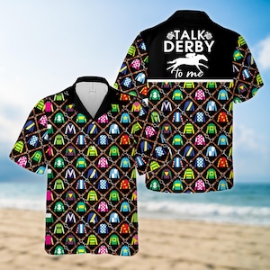 May include: A short-sleeved button-down shirt with a black background, featuring a pattern of colorful jockey silks and horse tack. The back of the shirt has the text "TALK DERBY to me" with a horse and rider graphic.