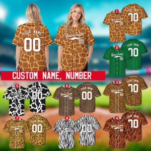 May include: Customizable button-down baseball jerseys featuring various animal print patterns including giraffe, cow, leopard, and tiger designs. Each jersey displays the text YOUR NAME and YOUR TEAM with the number 00 on the back and front.