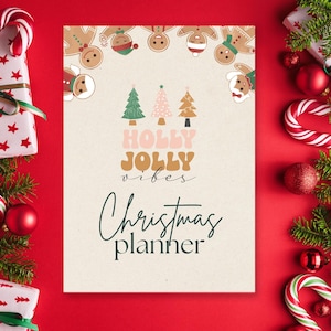 May include: A Christmas planner with the text "Holly Jolly Vibes" and "Christmas planner" on a cream background. The planner is surrounded by wrapped gifts, candy canes, and Christmas tree branches on a red background.