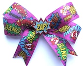 Comic hair clip Sound FX print ribbon with illustrated Zap charm by Dolly Cool Pow Bang Boom Bam Superhero