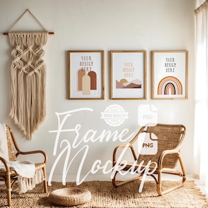 May include: Three framed illustrations with a boho aesthetic. The illustrations feature abstract shapes, a sunset landscape, and a rainbow. The frames are brown wood and the illustrations are in shades of brown, orange, and yellow. The frames are hanging on a white wall above a wicker chair.