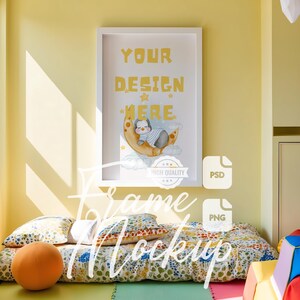 May include: A white frame mockup with a yellow background. The frame is hanging on a wall and has a watercolour illustration of a penguin sleeping on a crescent moon. The text "YOUR DESIGN HERE" is written in black letters on the illustration. The frame is surrounded by a white mount.