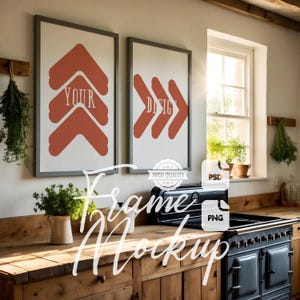May include: Two framed prints with abstract arrow designs in shades of orange and white, hanging on a wall in a rustic kitchen. The print on the left says "YOUR" and the print on the right says "DESIGN".