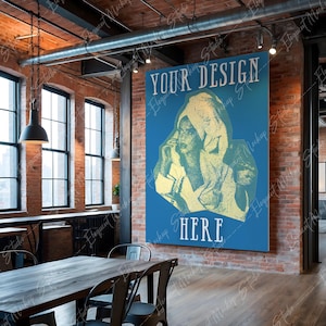 Op de afbeelding: Een blauwe poster met de tekst "YOUR DESIGN HERE" in wit. De poster toont een vintage-illustratie van een vrouw die een gewaad met capuchon draagt. De poster hangt aan een bakstenen muur in een loft-achtige ruimte.