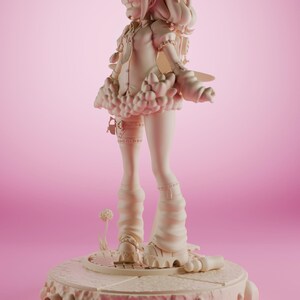 May include: A white figurine of a girl with pigtails wearing a skirt and boots. The figurine is standing on a round base with a textured surface.