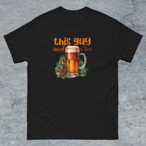 This Guy Needs a Beer Classic Tee - Funny Holiday T-Shirt for Beer Lovers, Perfect Gift for Him - Festive, Relaxed Fit, Comfy Casual Wear