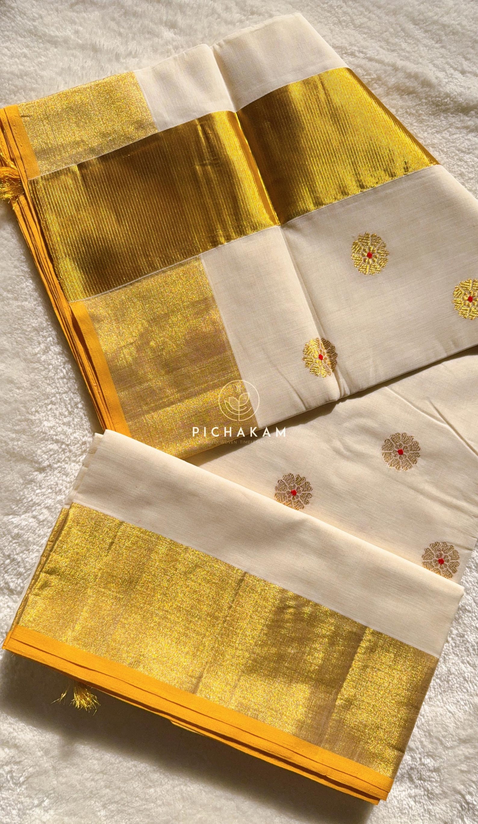 Pure handwoven Kasavu saree with meenakari flower motifs
