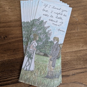 May include: A stack of bookmarks featuring a hand-drawn illustration of two people standing in a garden with a quote from the novel "Emma" by Jane Austen: "If I loved you less, I might be able to talk about it more." -Emma
