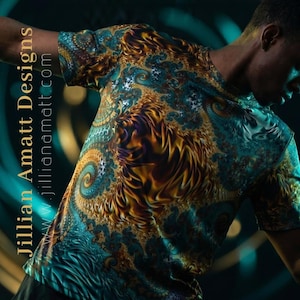 May include: A short-sleeved shirt with a vibrant, swirling fractal design in shades of teal, gold, and purple. The shirt features the text "Jillian Amatt Designs" and the website address "www.jillianamatt.com" in a vertical orientation.