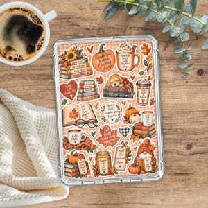 May include: A clear tablet case featuring a collage of autumn-themed stickers including pumpkins, stacks of books, coffee mugs with text like Pumpkin Spice, and a gnome. The designs incorporate warm orange, brown, and cream colors with fall foliage.