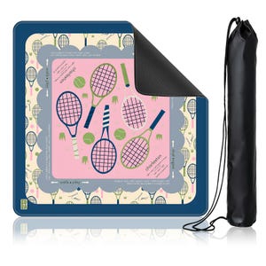 May include: A rectangular tennis-themed mat with a pink center featuring tennis rackets and balls. The mat has a navy blue border and a black carrying bag. The design includes the word "Charleston" and the phrase "walls + play".