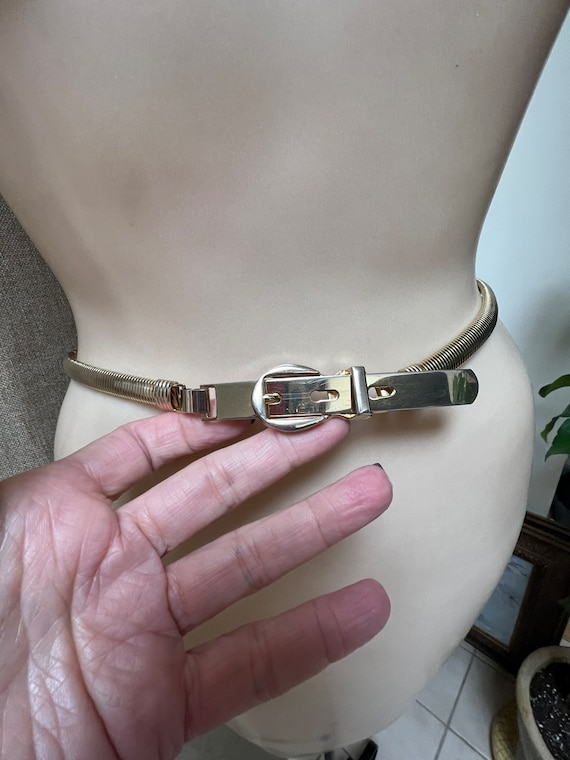 Vintage stretch snake belt S. 24-27" goldtone stre