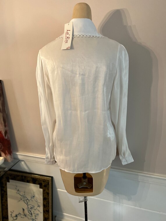 Dressy white long store sleeve blouse