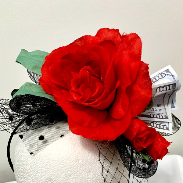 Run for the Roses, is the name of this adorable Kentucky Derby fascinator.   Black fascinator adorned with red roses & the horses winnings!