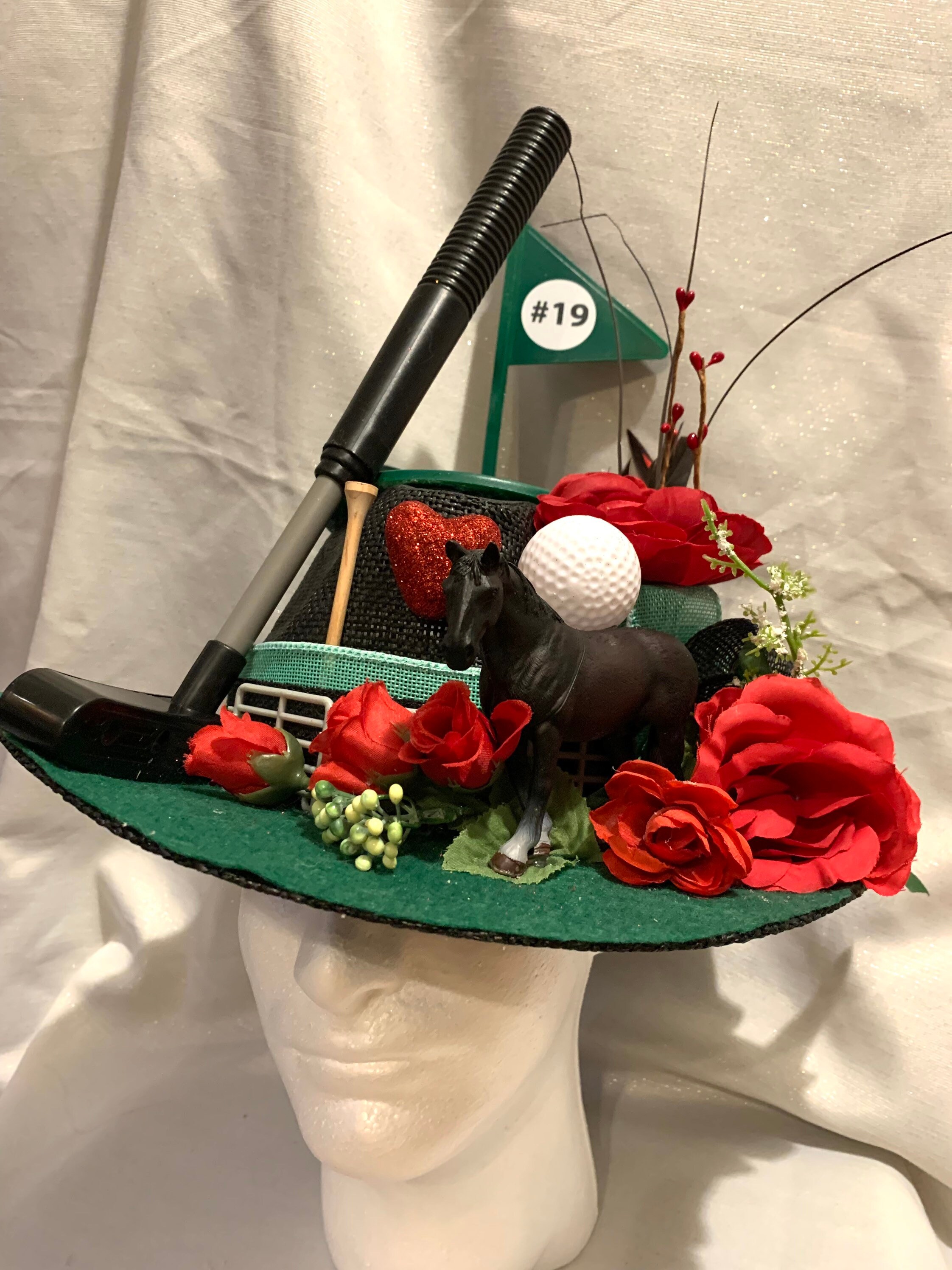 Kentucky Derby Christmas Themed Hat The Most Over-the-Top Hats Spotted at the Kentucky Derby main image 4