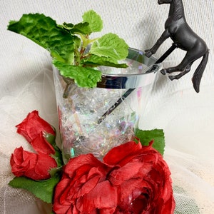 I call this Kentucky Derby fascinator, “Down the Hatch”.  Check out the cute mint julep drink adorned with red roses. So sweet!