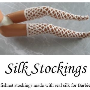 May include: White fishnet stockings made with real silk for Barbie dolls.