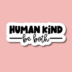 May include: White sticker with black text that reads "HUMAN KIND - be both -"