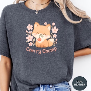 Unisex  cotton T-shirt with playful cherry chomp fox graphic, kawaii animal design, streetwear style, casual kawaii fashion, trendy top