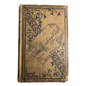 May include: An antique book titled "The Reading Club" with a tan cover and black decorative elements. The cover features the title in elegant script, the editor's name, and the number "No. 4". The book's design includes floral and geometric patterns.