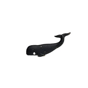 May include: A small, black whale figurine with a curved tail and a white spot near its head. The whale has a slightly textured surface and a gold-colored accent on the tail. The figurine is set against a white background.