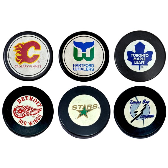 Vintage Official NHL Ziegler Tire Slug Hockey Pucks