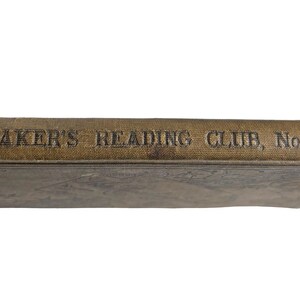 May include: An antique book with a worn, textured cover. The spine, in a faded tan color, reads "BAKER'S READING CLUB, No. 4" in embossed lettering. The book's edges show signs of age and wear, suggesting it is a vintage item.