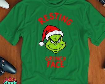 Resting Grinch Face Shirt, Green Tee with Grinch Illustration in Santa Hat, Funny Holiday T-Shirt, Christmas Humor Shirt, Grinch Gift Tee