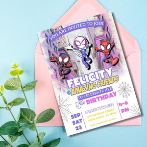 May include: A pink invitation card with the text "YOU ARE INVITED TO JOIN" and "FELICITY AMAZING FRIENDS" to celebrate a 5th birthday. The card features illustrations of Spider-Man characters and a spider web design. The invitation is inside a pink envelope.