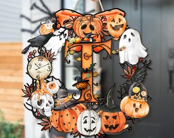 May include: A Halloween-themed wreath with an orange bow, pumpkins, ghosts, and a letter "T". The wreath features a variety of spooky elements, including a skull, a clock, and a crow. The design is colorful and festive, perfect for seasonal decor.
