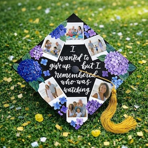 May include: Black graduation cap decorated with photos, blue and purple hydrangea flowers, and the quote "I wanted to give up, but I remembered who was watching." A gold tassel hangs from the cap.