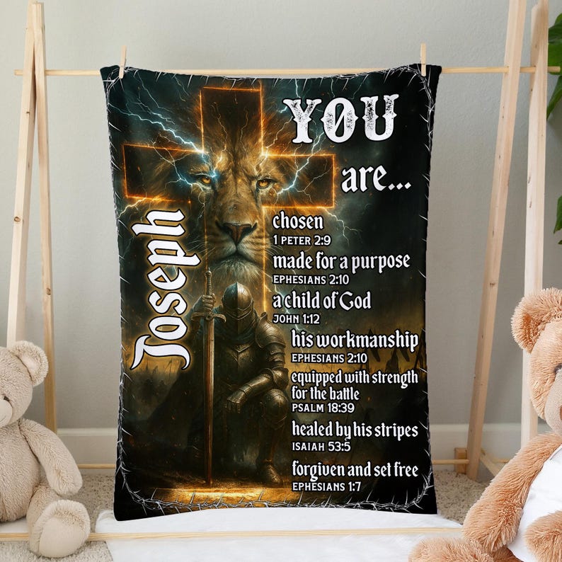 May include: A black blanket featuring a lion's face within a cross design, with the name "Joseph" and uplifting text. The text includes phrases such as "chosen," "made for a purpose," and "a child of God."