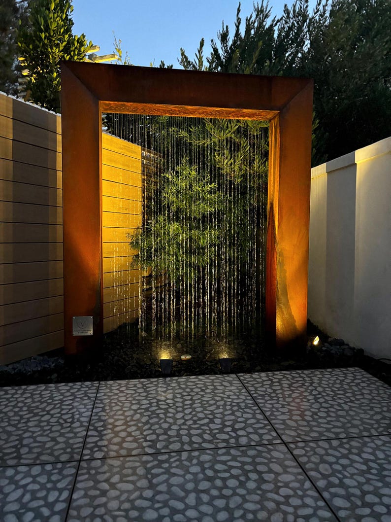 “Door style rain curtain fountain in corten steel — modern outdoor water feature, backyard garden decor, patio fountain for relaxation” “Corten steel rain curtain water feature — peaceful outdoor fountain for backyard, patio, or garden — creates calming waterfall sound” “Luxury corten steel rain curtain fountain — modern door design outdoor water feature for upscale backyard, pool, or garden oasis”