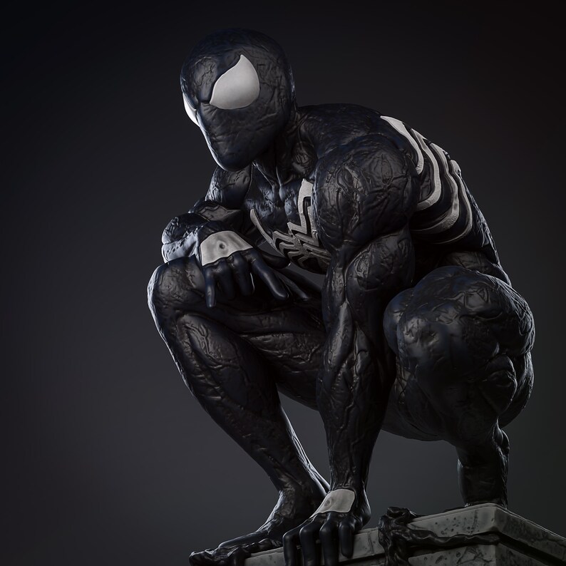 May include: Black and white figurine of a superhero in a crouching pose. The figure has a textured, black, and white suit with a spider symbol on the chest. The figure is posed on a gray stone base.