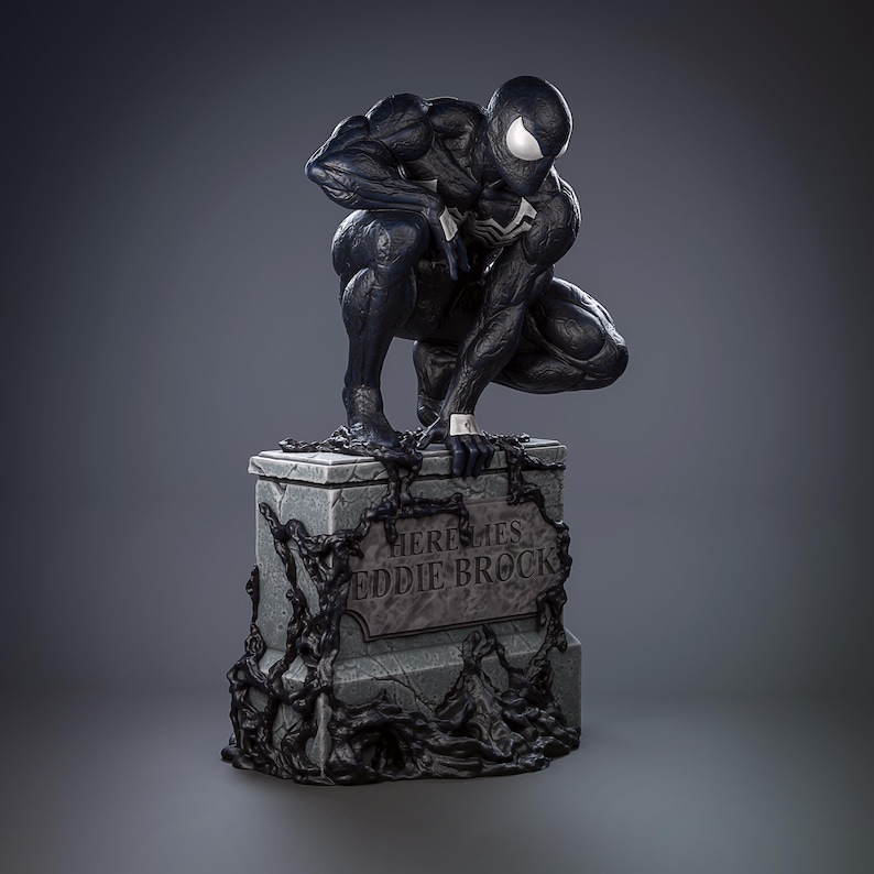 May include: Black and white figurine of Venom, a Marvel Comics superhero, crouching on a tombstone with the inscription "Here Lies Eddie Brock".