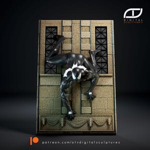 May include: A 3D printed figurine of a superhero in a black suit climbing a brick wall. The figurine is posed in a dynamic action pose with one leg extended and the other bent. The superhero's face is visible and has a white mask with black eyes. The background is a dark grey.
