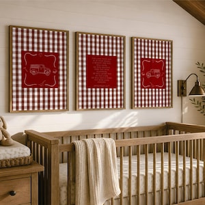 May include: Three framed wall art prints featuring a red and white gingham pattern background. The two outer prints display a white line drawing of a pickup truck, while the center print contains white text that reads Zephaniah 3:17.
