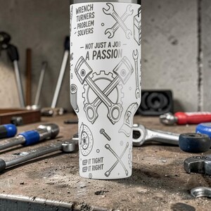 May include: A white tumbler with a black and gray mechanic-themed design. The tumbler features wrenches, pistons, and gears, with text that reads "Wrench Turners - Problem Solvers - Not Just a Job - A Passion" and "Keep it Tight, Keep it Right."
