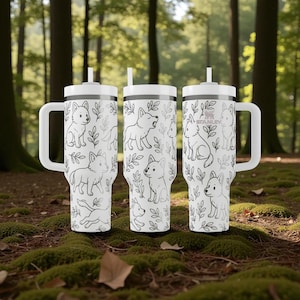 May include: Three white insulated tumblers with black line drawings of dogs and leaves. Each tumbler has a white handle, lid, and straw. The tumblers are on green moss in a forest. Each holds approximately 700ml.