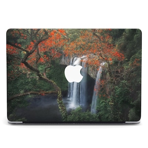May include: A laptop skin with a scenic image of a waterfall cascading through lush green foliage and vibrant red and orange leaves. The Apple logo is visible in the center of the image.